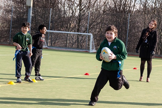 Children playing rugby